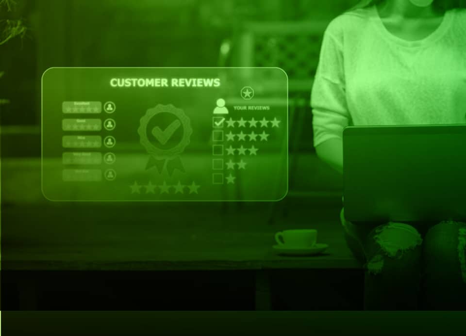 woman sitting om step outside working on computer with customer review card showing 5 stars and large check mark representing excellent review